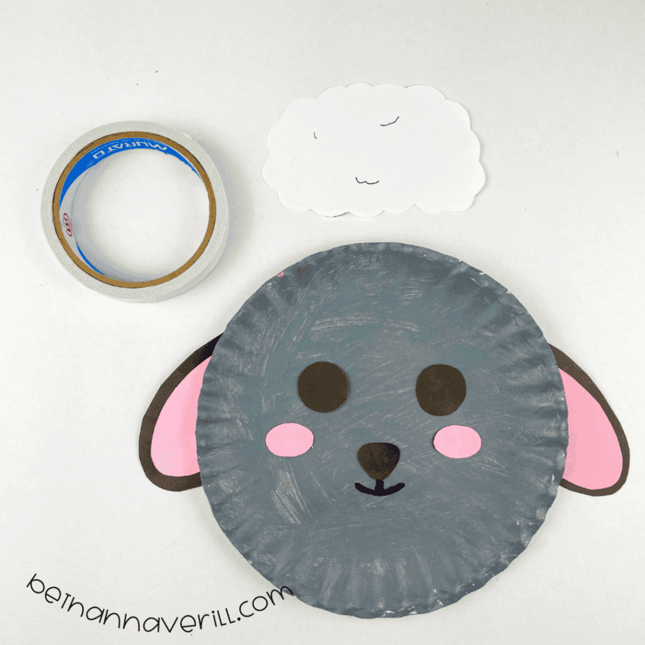 White wool piece above the sheep plate with tape