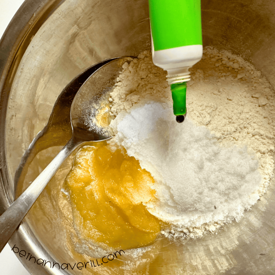 Green food dye squeezed into the applesauce playdough mixture