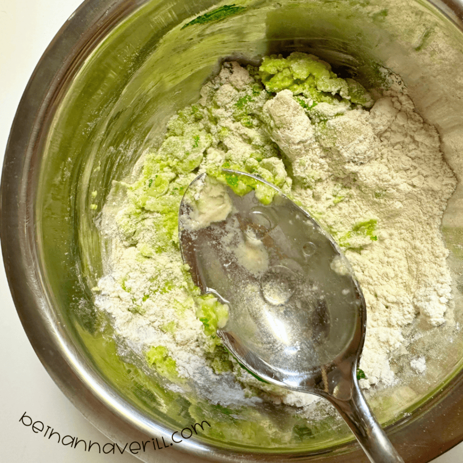 Water and vegetable oil stirred into the green apple playdough mixture