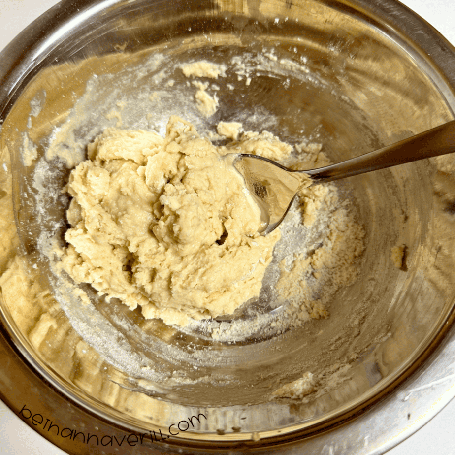 Chamomile tea playdough coming together into a ball in a mixing bowl