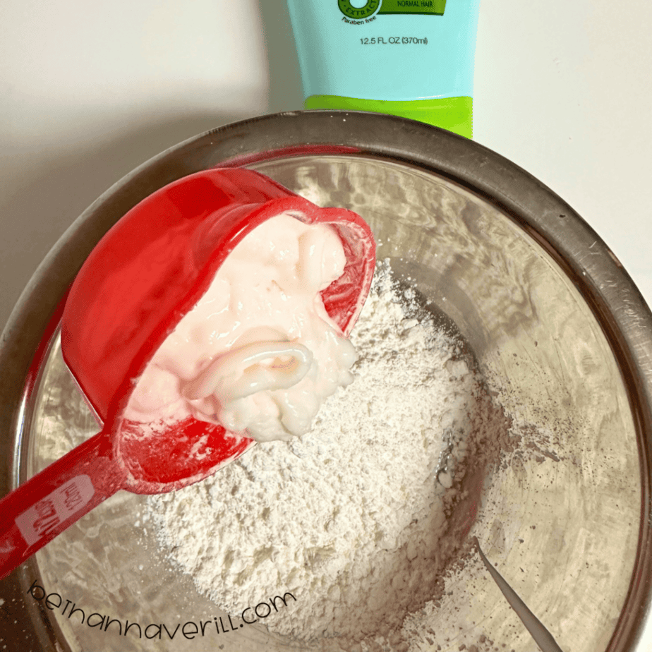 White hair conditioner added to cornstarch in a mixing bowl