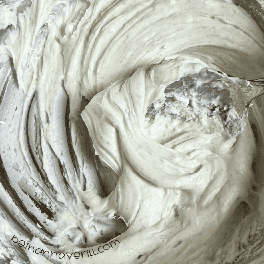 Fluffy white snow dough stirred together in a metal mixing bowl
