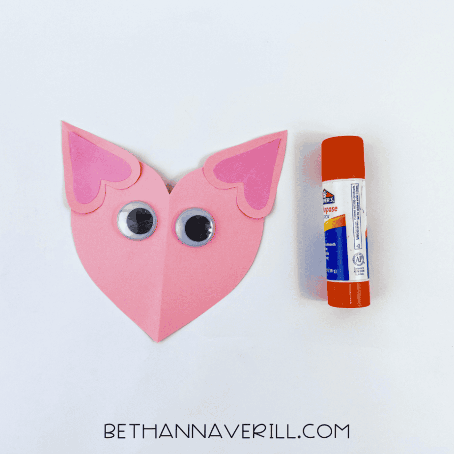 Googly eyes added to the heart cat