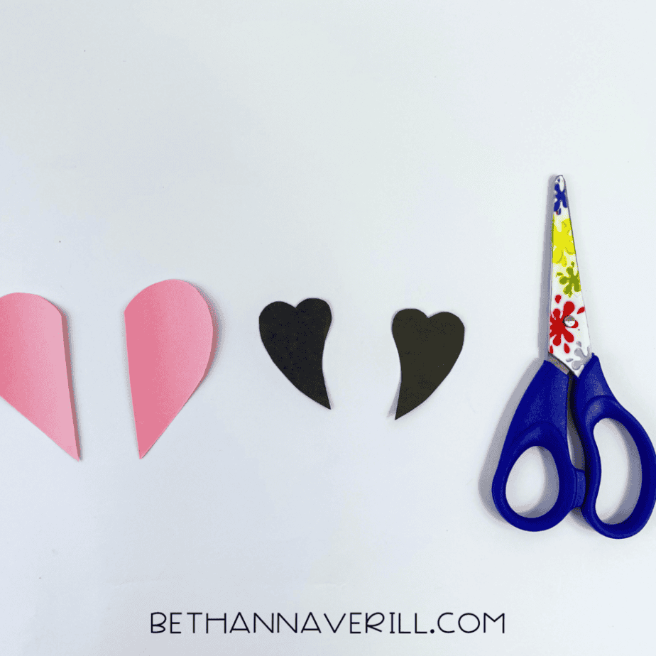 Pink paper ears and black heart horns cut out