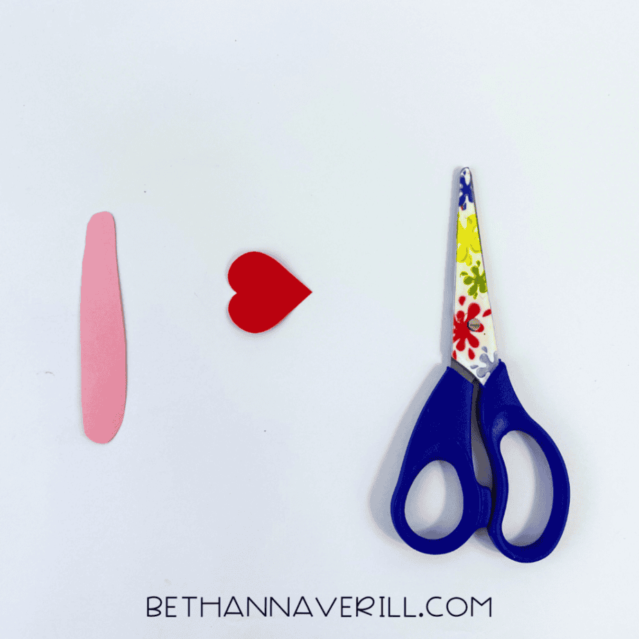 Pink paper neck and small red heart head
