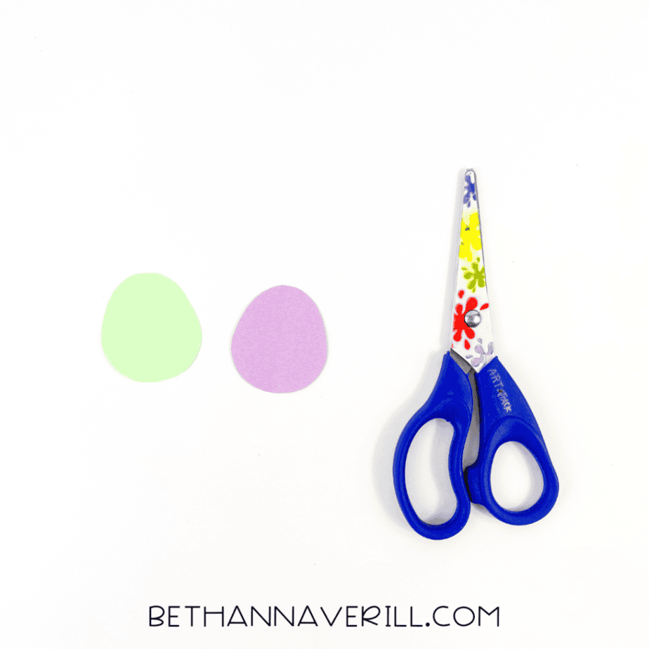 Green and purple paper Easter eggs cut out