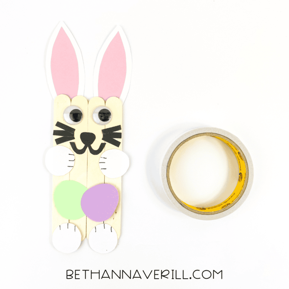 Easter eggs glued between the bunny’s paws