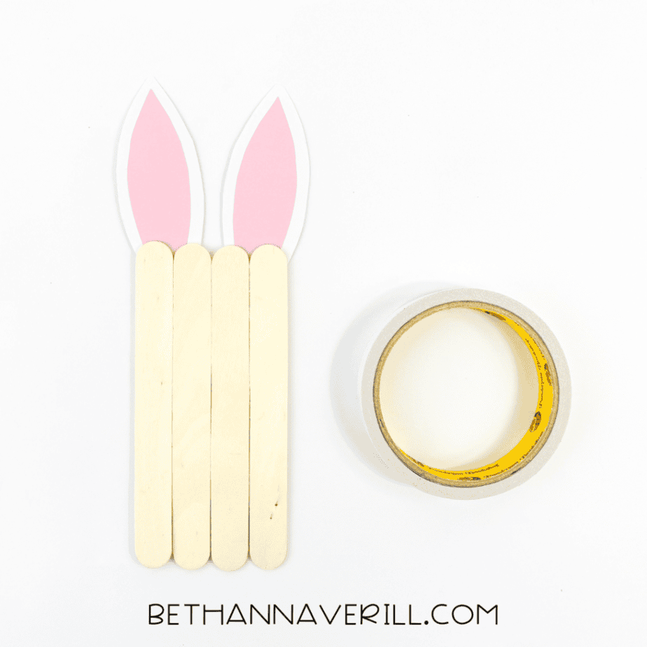 Bunny ears attached to the top of the popsicle sticks