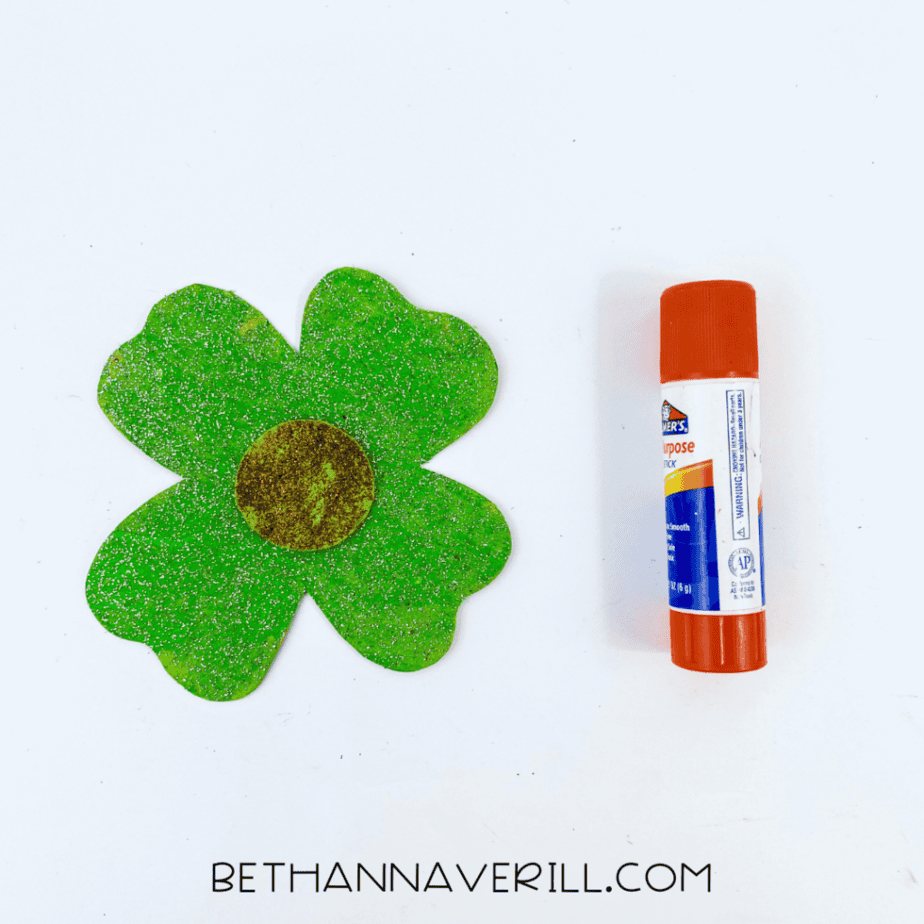 Gold circle glued to the center of the green shamrock