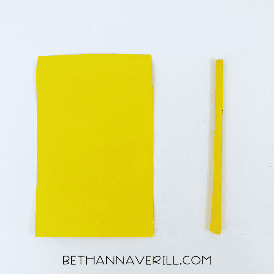 Yellow paper and the rolled wand handle