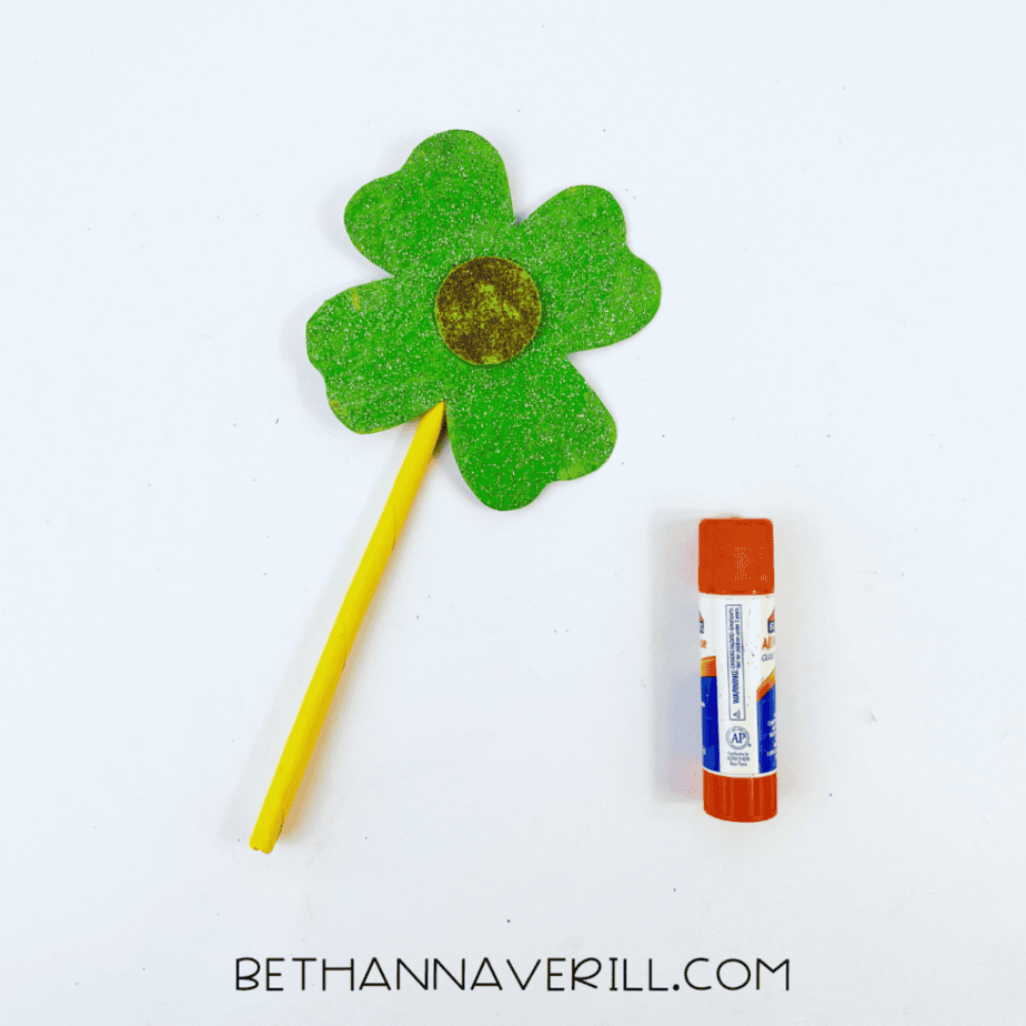 Shamrock glued to the top of the yellow wand handle
