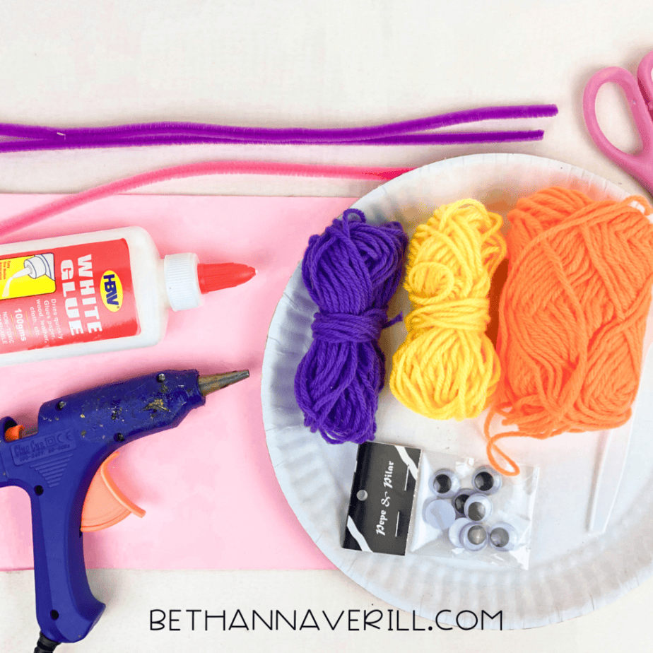 Spoon butterfly supplies: foam sheet, pipe cleaners, yarn, plastic spoon, googly eyes and glue gun