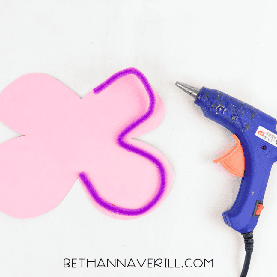 Purple pipe cleaner glued around the edge of the foam wings