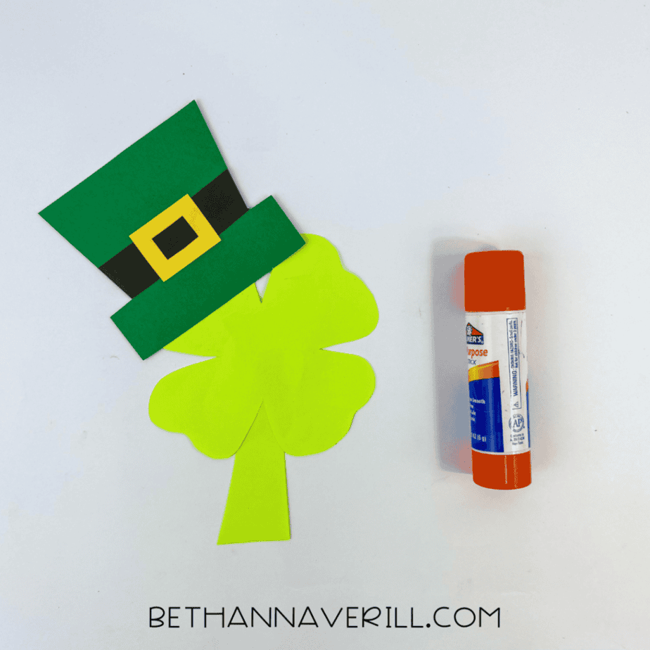 Leprechaun hat glued on top of the paper shamrock