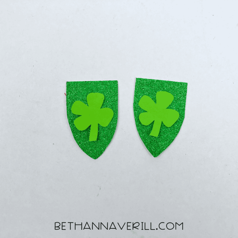 Shamrocks glued onto the green banners