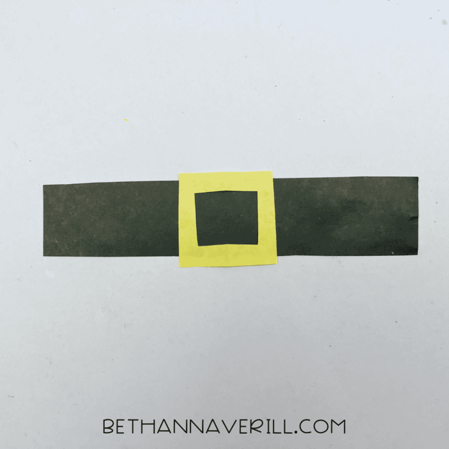 Yellow buckle glued onto the black band