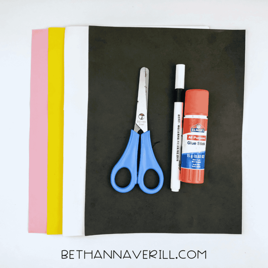 Valentine bee supplies: yellow, black, pink and red paper, glue stick, marker and scissors