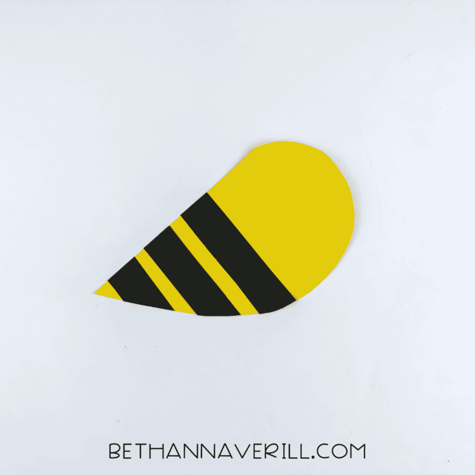Black stripes glued onto the yellow bee body