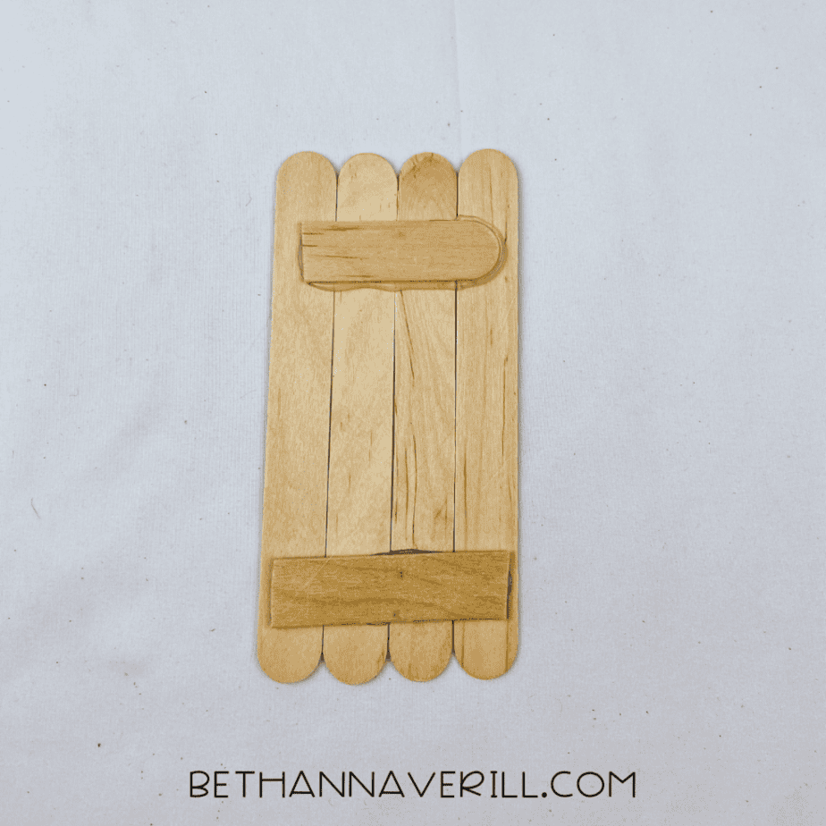 Craft stick halves glued across the back of the body