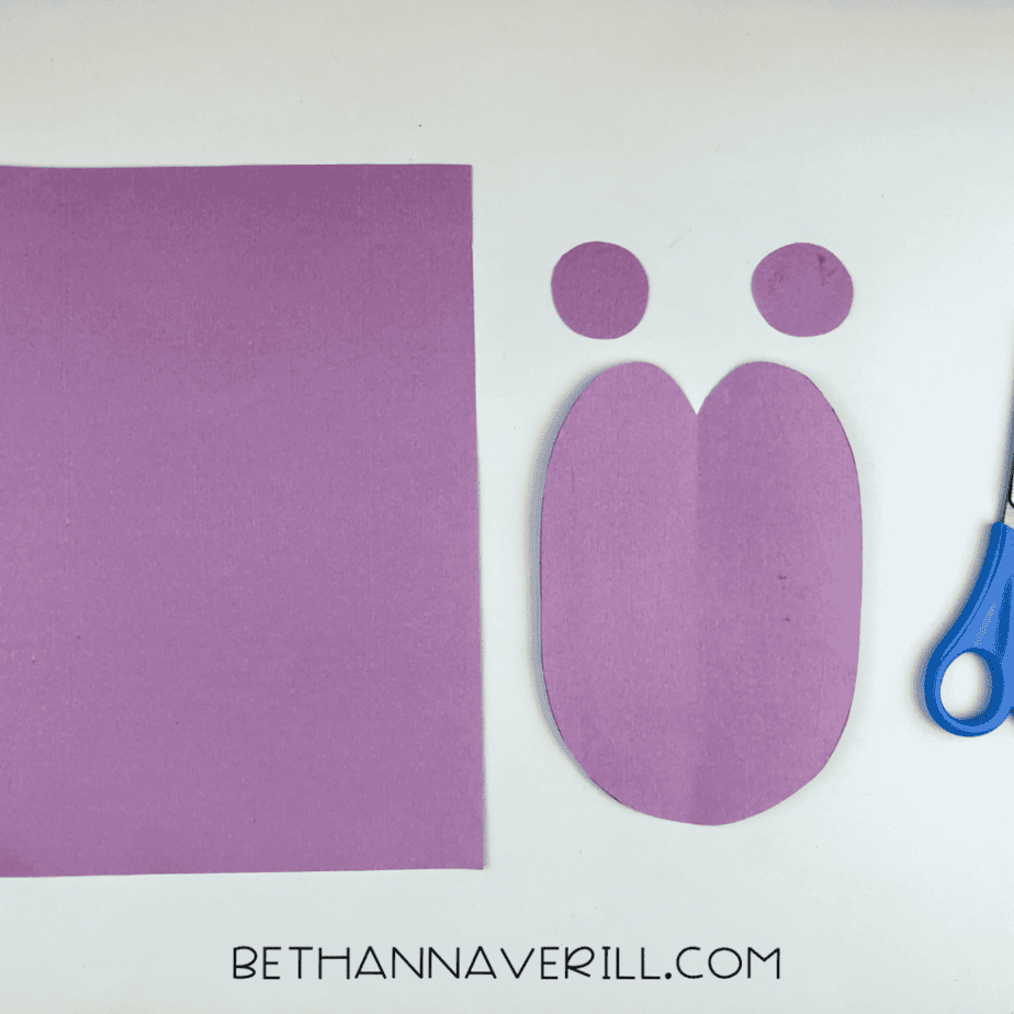 Purple paper heart body and circles cut out