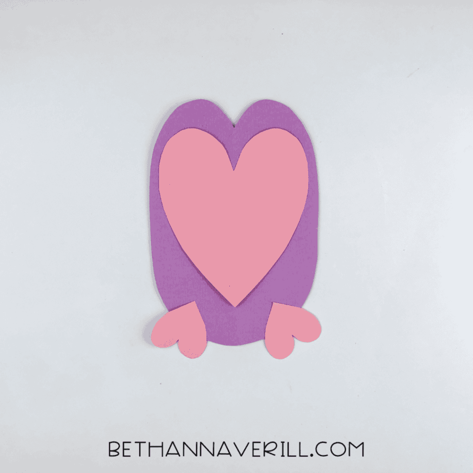Pink heart and feet glued onto the purple owl body