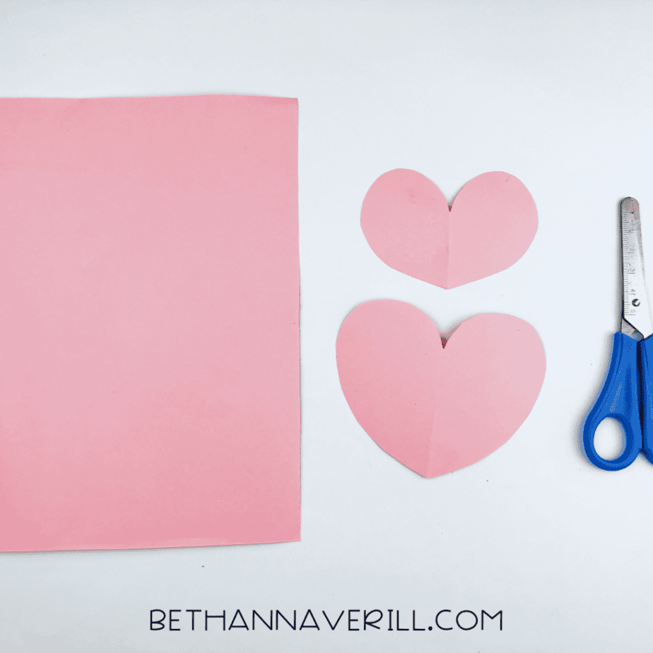 Two pink paper hearts cut out