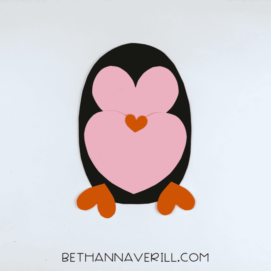 Orange heart feet and beak added to the penguin
