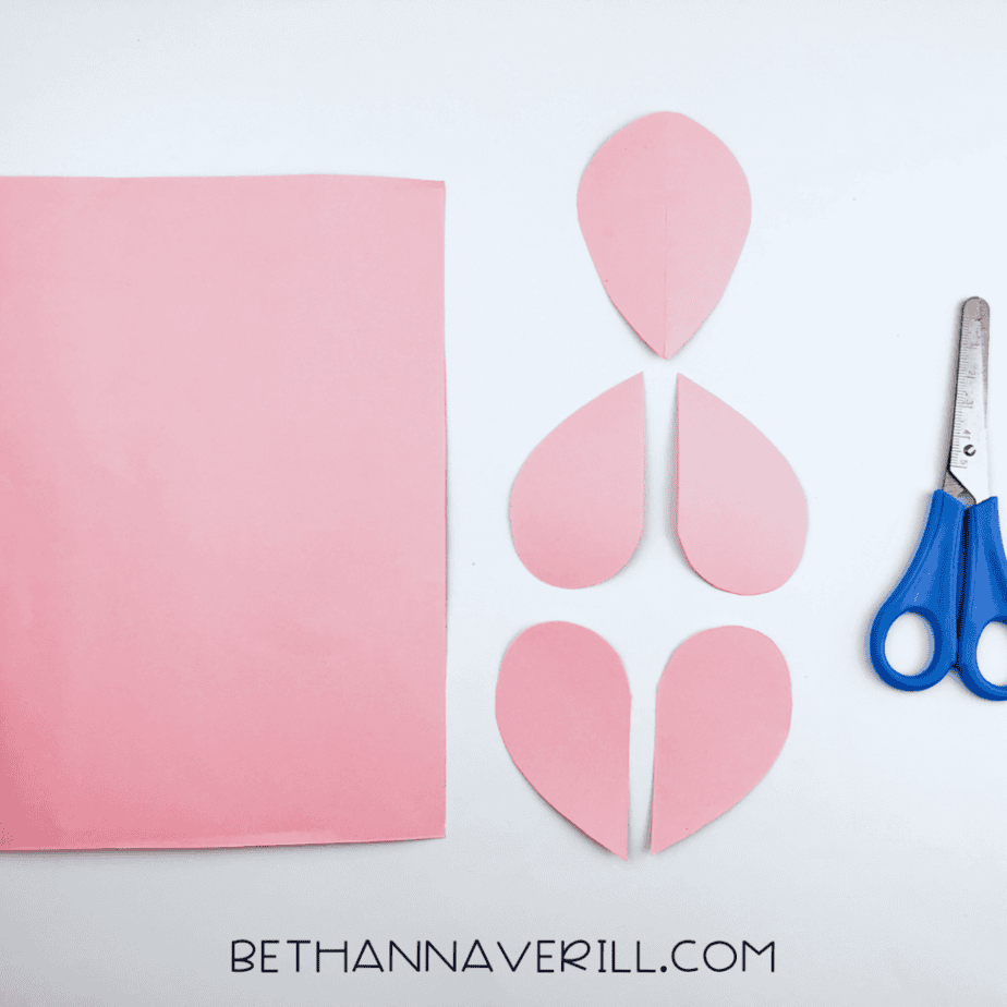 Pink paper teardrops cut out for the head and legs