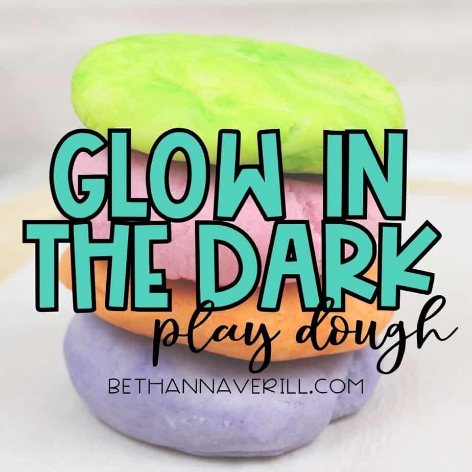 A tall stack of smooth, colorful play dough discs—green, pink, orange, and purple—with the bold title text “Glow in the Dark Play Dough” overlaid.