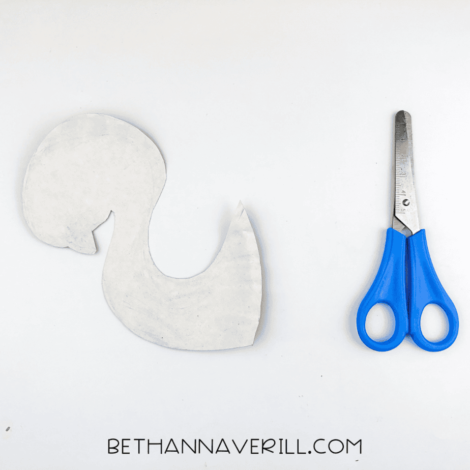 A second piece from the plate shaped into a flamingo neck and head.