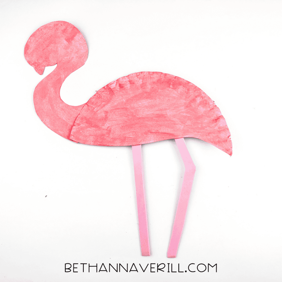 The flamingo now has long, floppy pink legs glued underneath its body.
