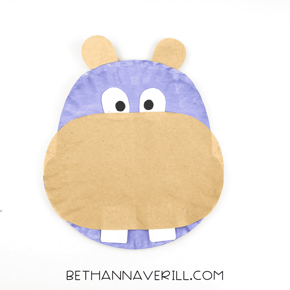 Two brown ears glued to the top of the hippo’s head.