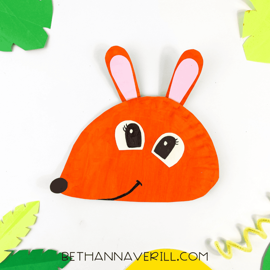 Completed kangaroo craft displayed with bright green and yellow paper leaves around it