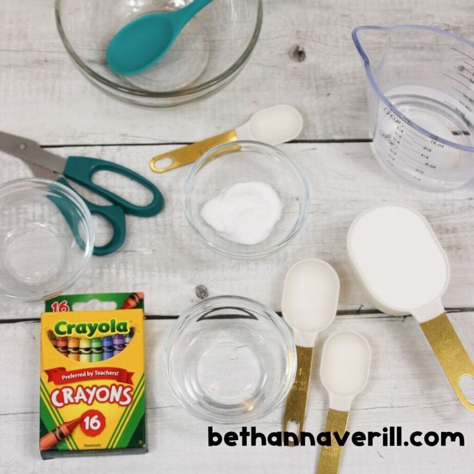 Glue, baking soda, contact solution, crayons and scissors