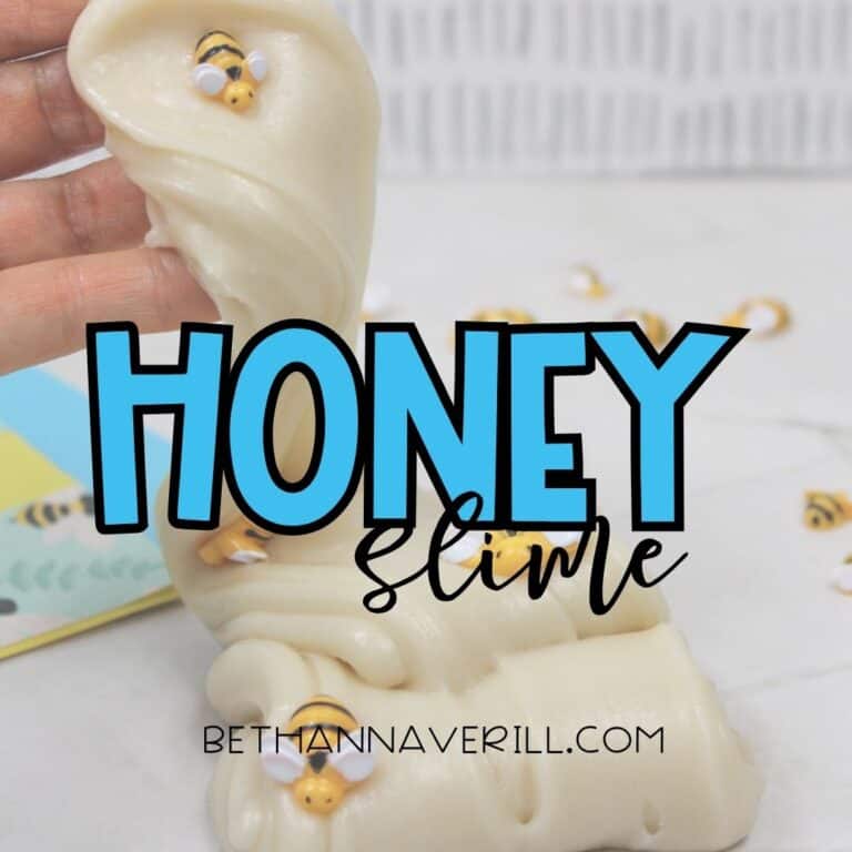 Creamy, honey-colored slime being stretched by hand, decorated with small plastic bees, with the bold text "HONEY slime" and the website bethannaverill.com overlaid.