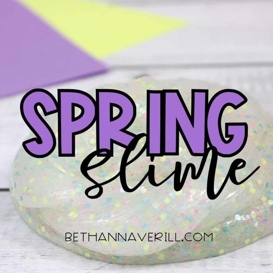 A swirled blob of pastel glitter slime on a light wood surface with purple and yellow paper in the background. Overlaid text reads “SPRING Slime” with “bethannaverill.com” below.