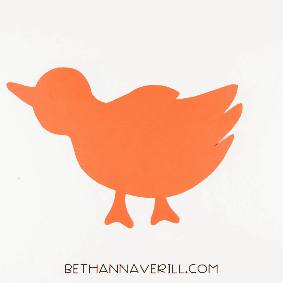Orange bird base assembled with beak and legs.