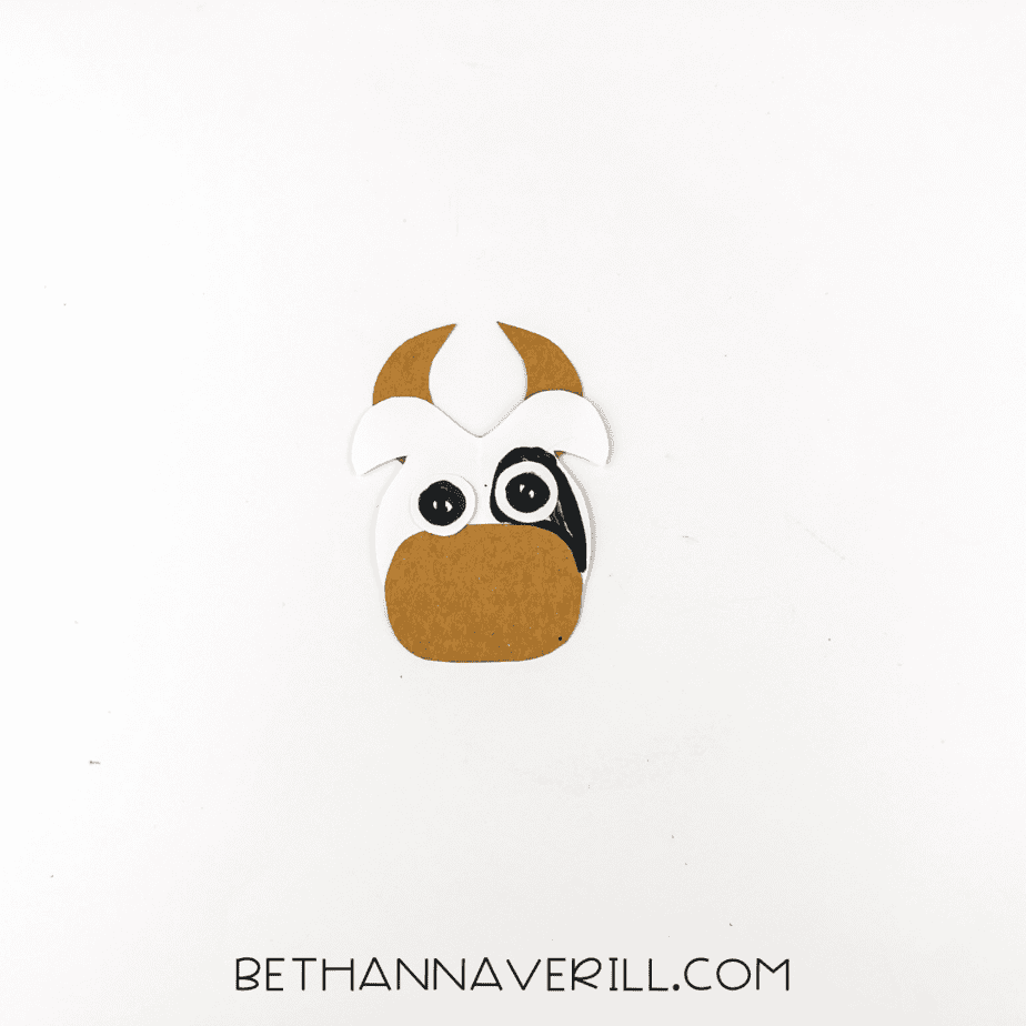 Cow head completed with pupils drawn and a black patch over one eye.