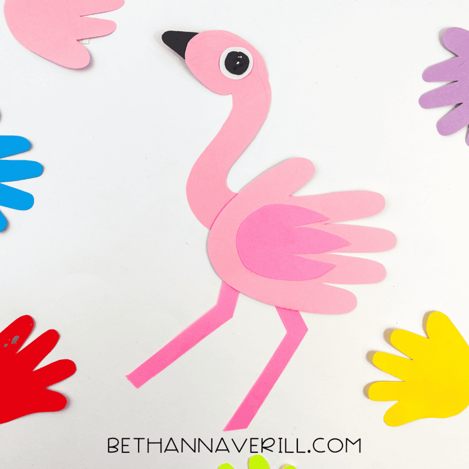Final display with the flamingo surrounded by other colorful handprints.