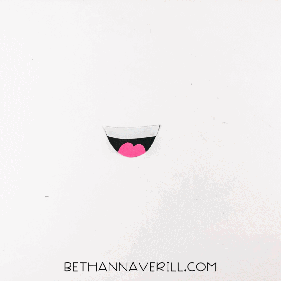 Pink tongue glued onto the black and white mouth shape.