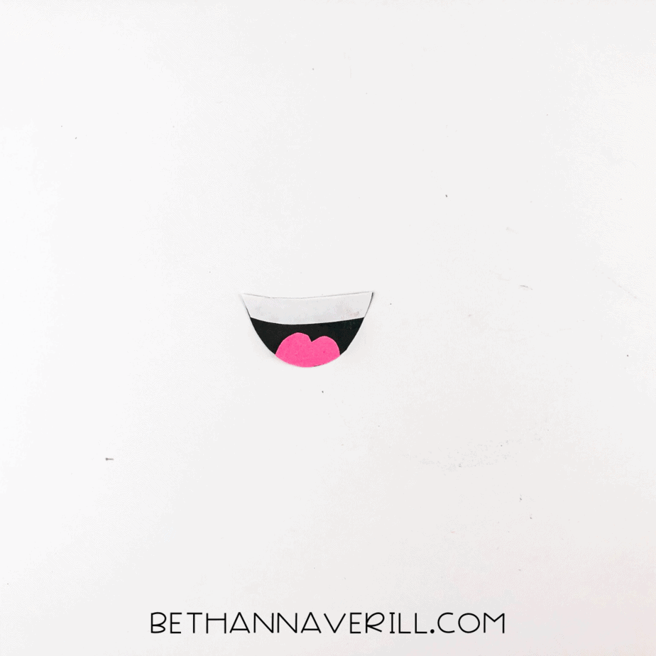 Pink tongue glued onto the black and white mouth shape.