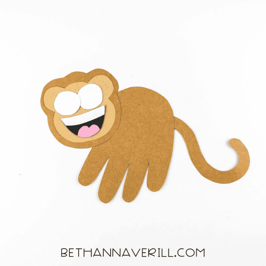 Monkey face with eyes and mouth glued in place.