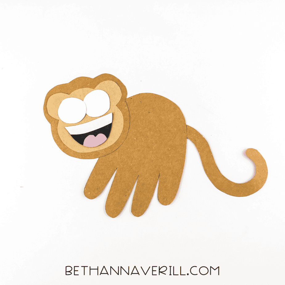 Monkey face with eyes and mouth glued in place.