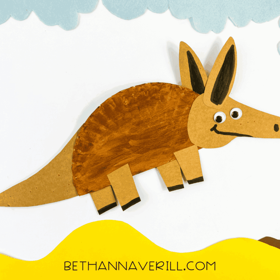 Completed paper plate aardvark craft displayed on a colorful background.