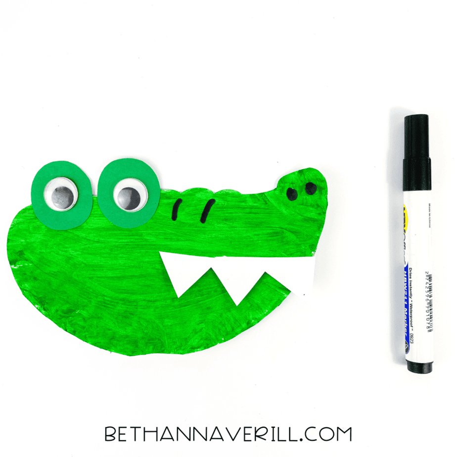 Black marker details added to the green alligator face—nostrils and goofy brow lines included!