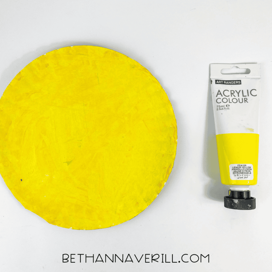 yellow painted paper plate