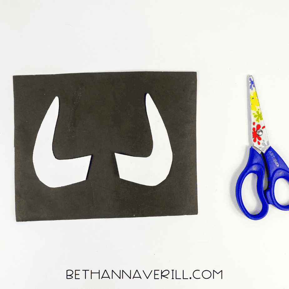 White tusks traced and cut from paper