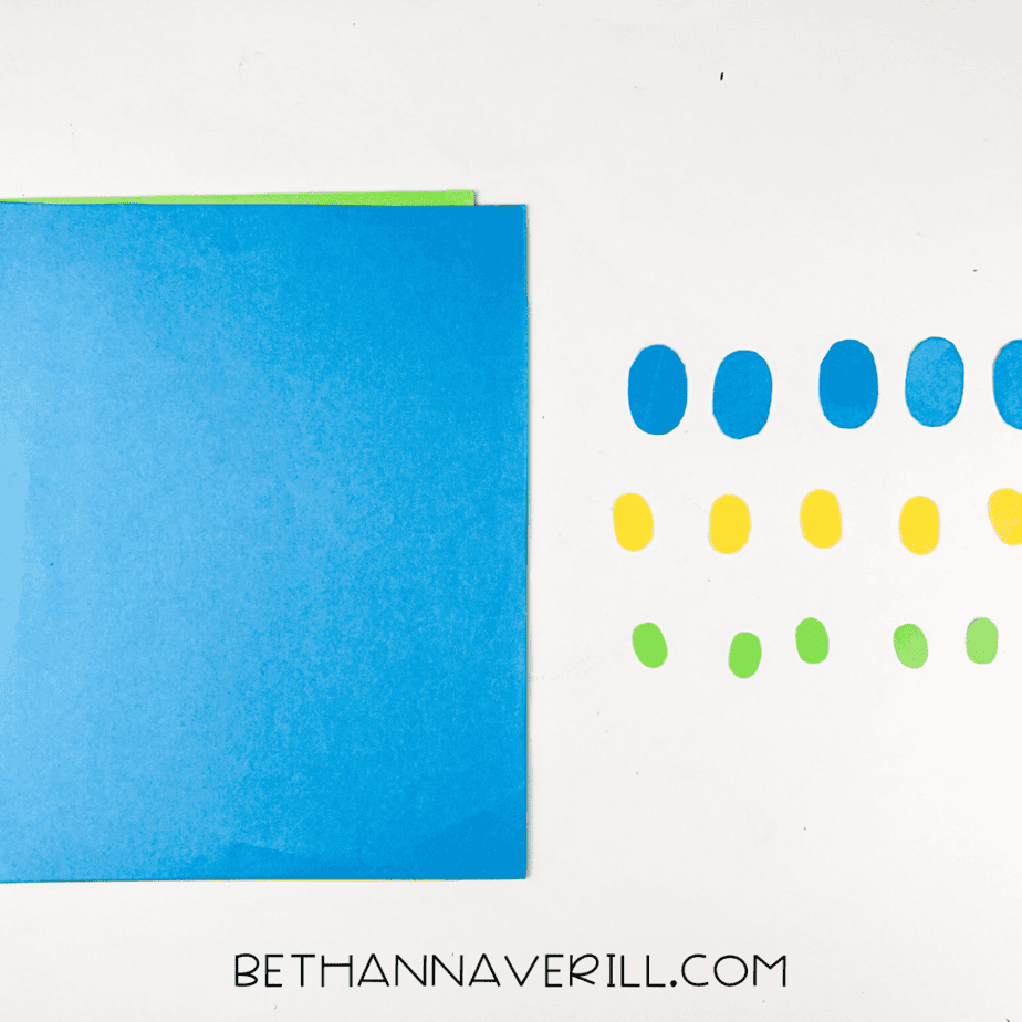 Blue, yellow, and green ovals cut out for feathers.