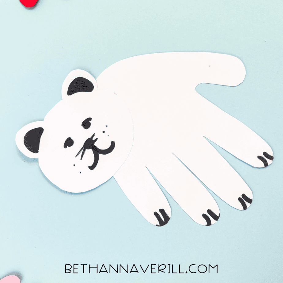 Finished polar bear craft displayed on a blue background