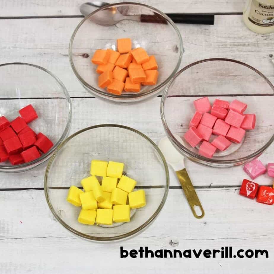 Unwrapped Starburst candies sorted by color